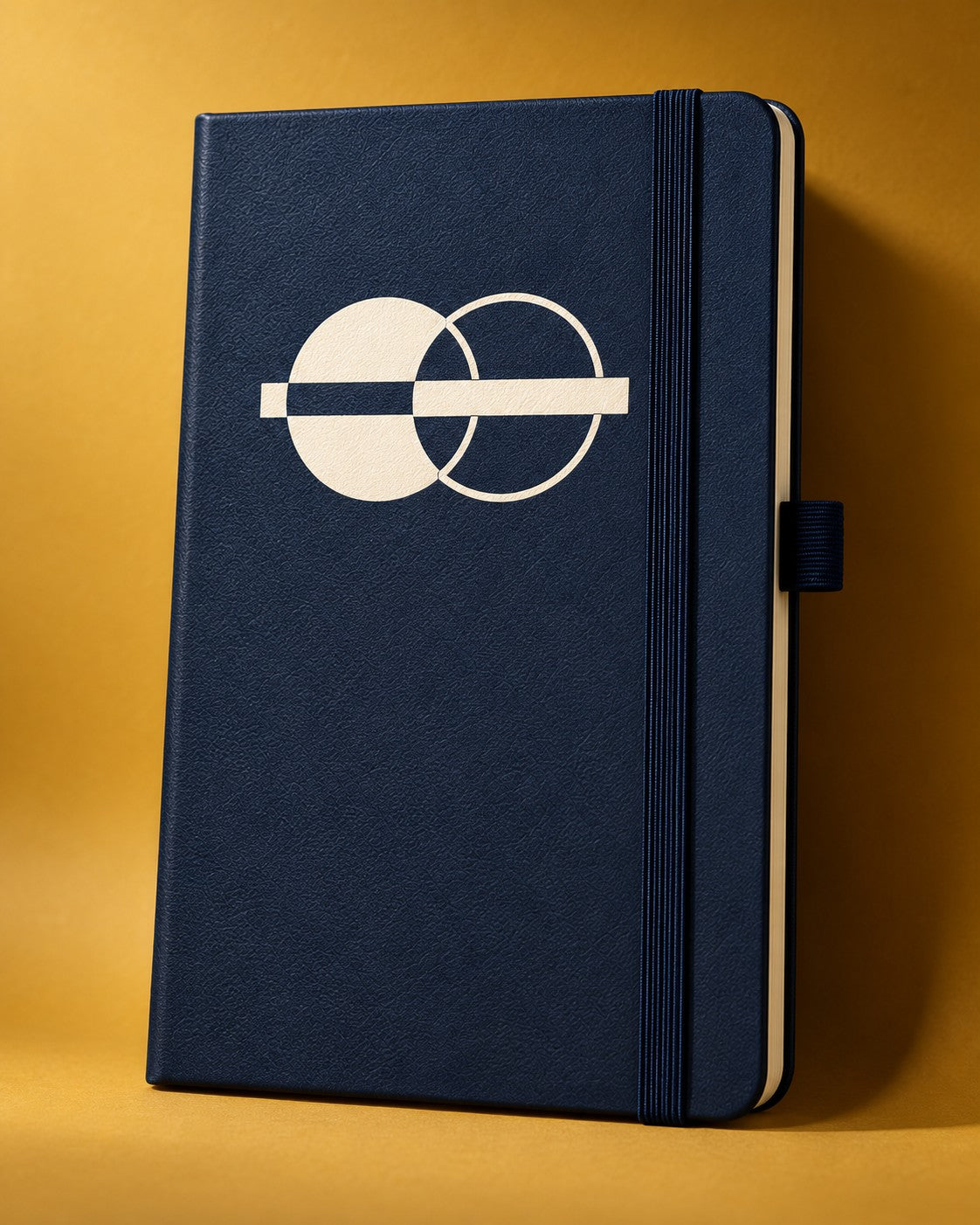 Navy Infinote Classic notebook with a flat off-white silkscreen mark