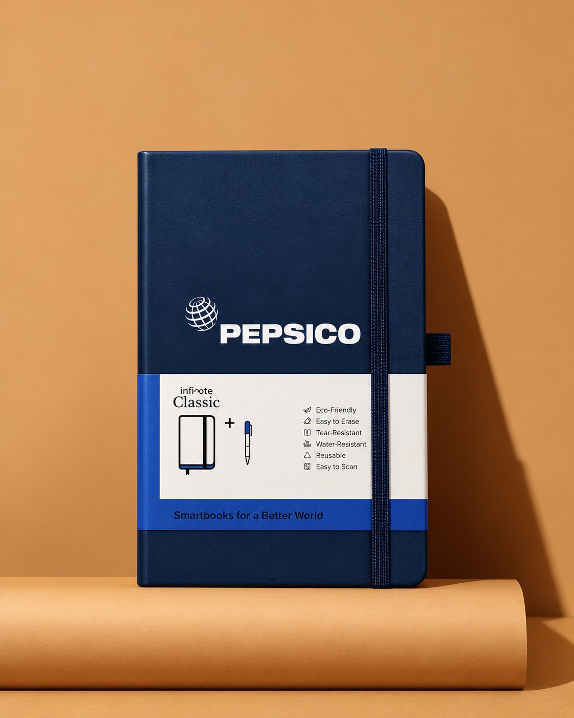 Navy Infinote Classic notebook with PepsiCo identity against a caramel backdrop