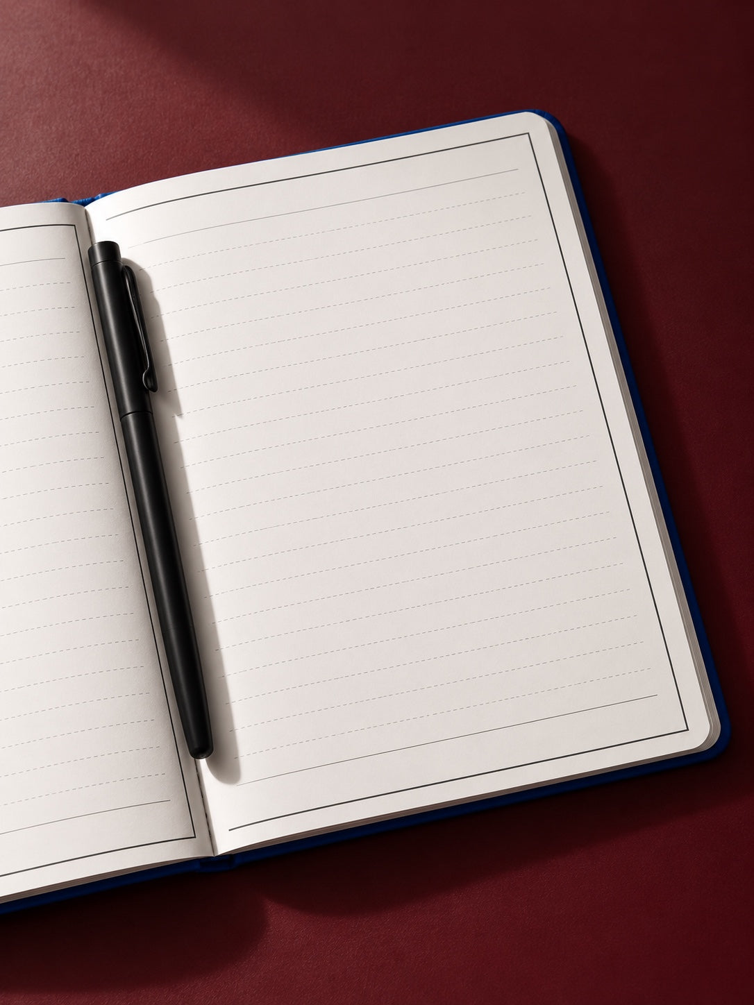 Open notebook with a pen